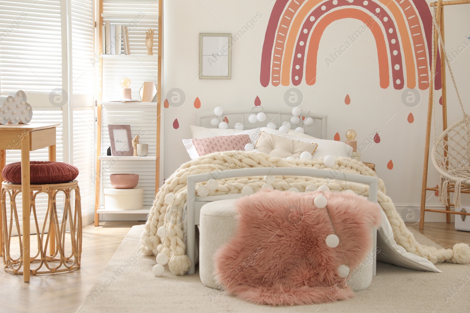 Photo of Stylish child's room interior with comfortable bed