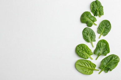 Fresh leaves of spinach isolated on white, top view