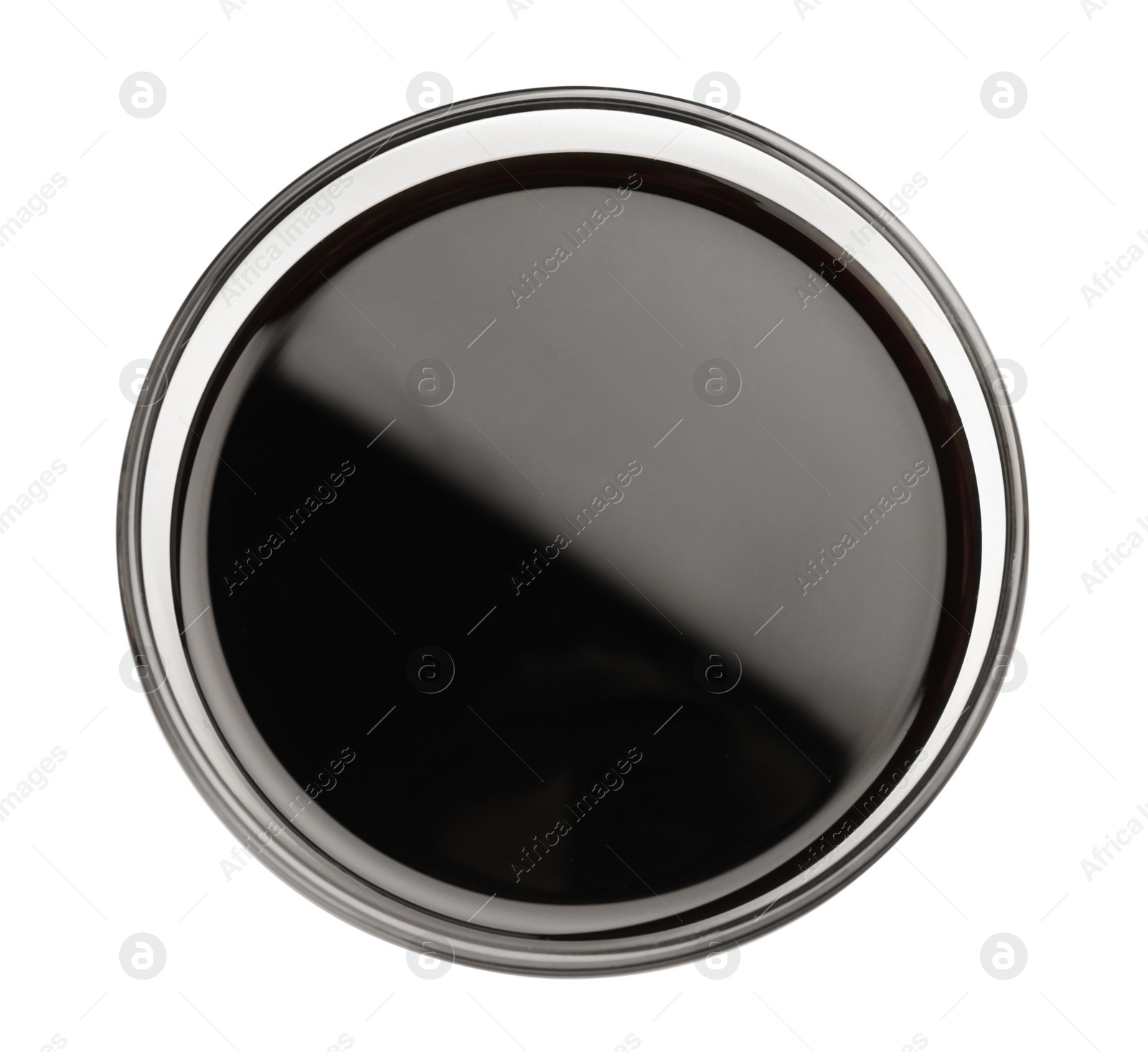 Photo of Bowl of soy sauce isolated on white, top view