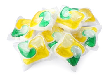 Photo of Pile of dishwasher detergent pods on white background