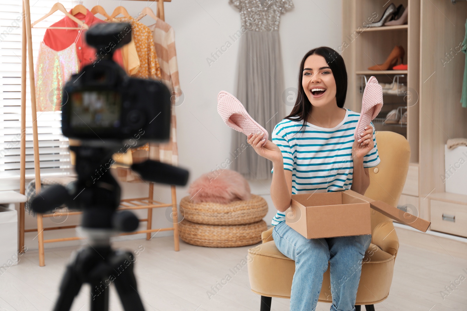 Photo of Fashion blogger recording new video in room