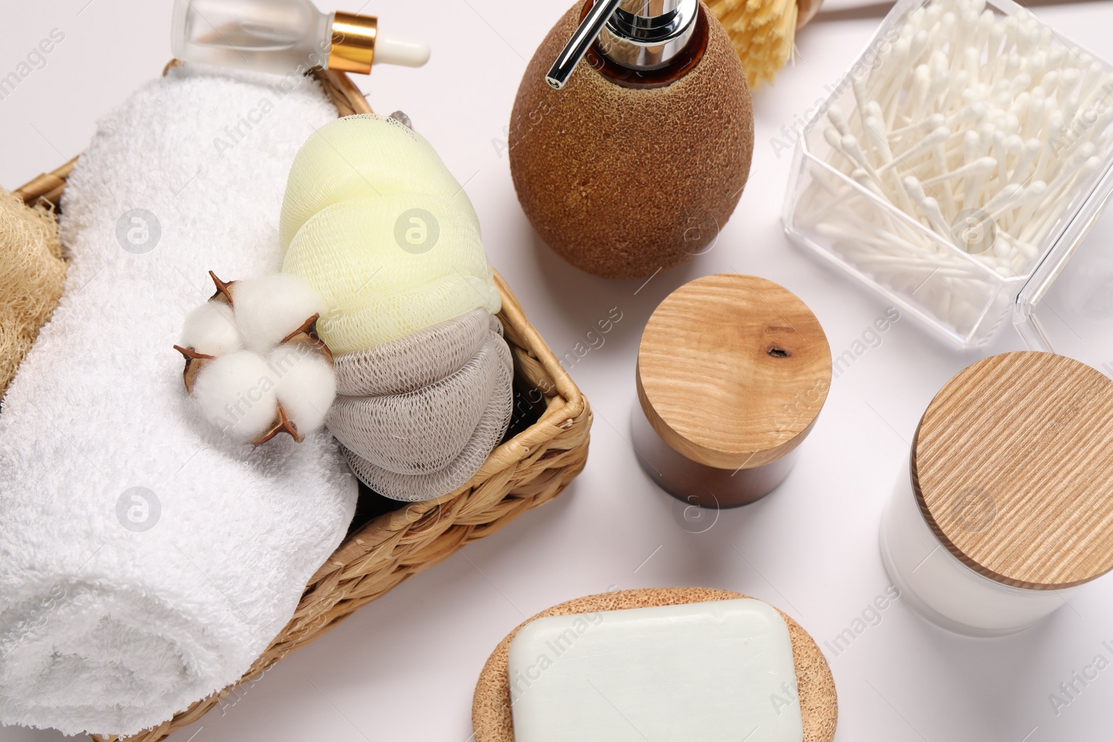 Photo of Bath accessories. Different personal care products and cotton flower on white background, above view