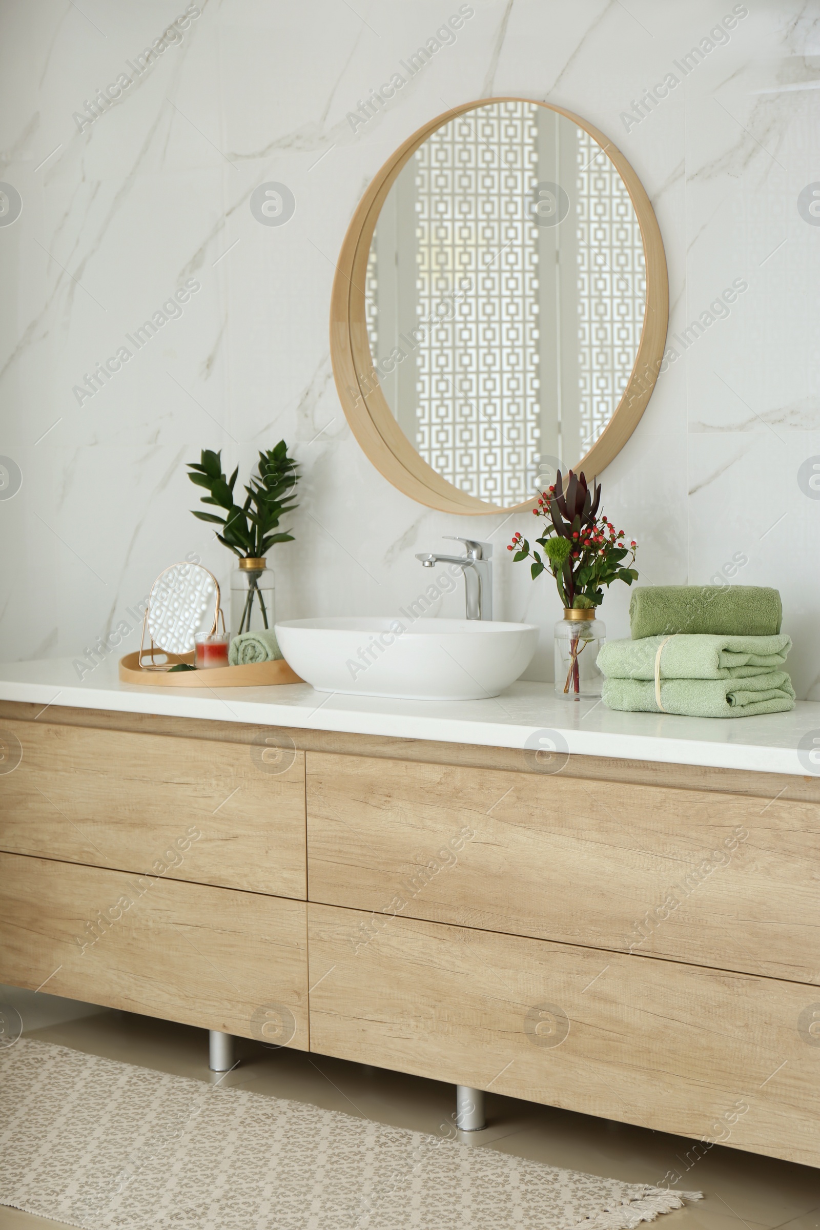 Photo of Modern bathroom interior with stylish mirror and vessel sink