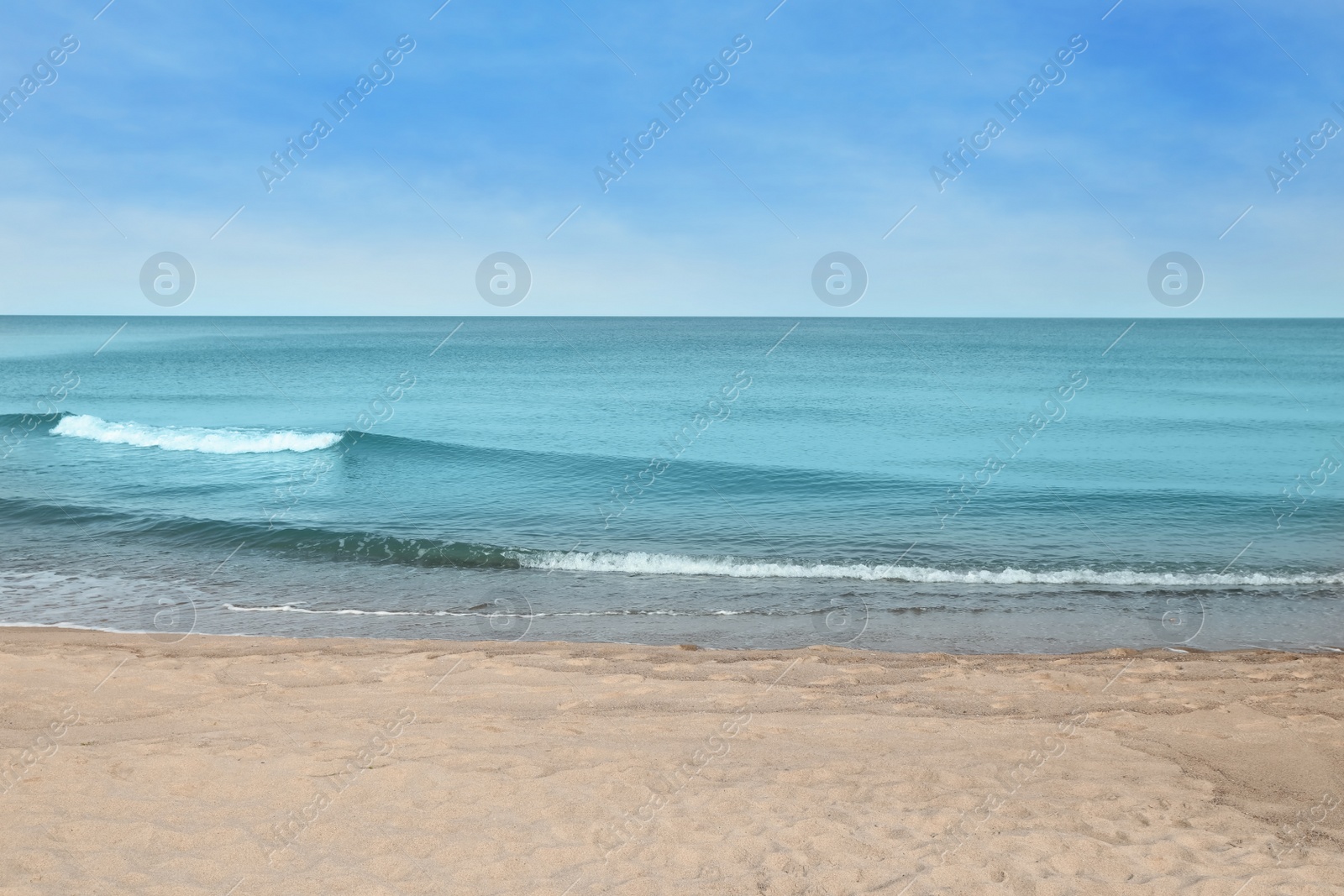 Photo of Beautiful view of sea shore under blue sky on sunny day