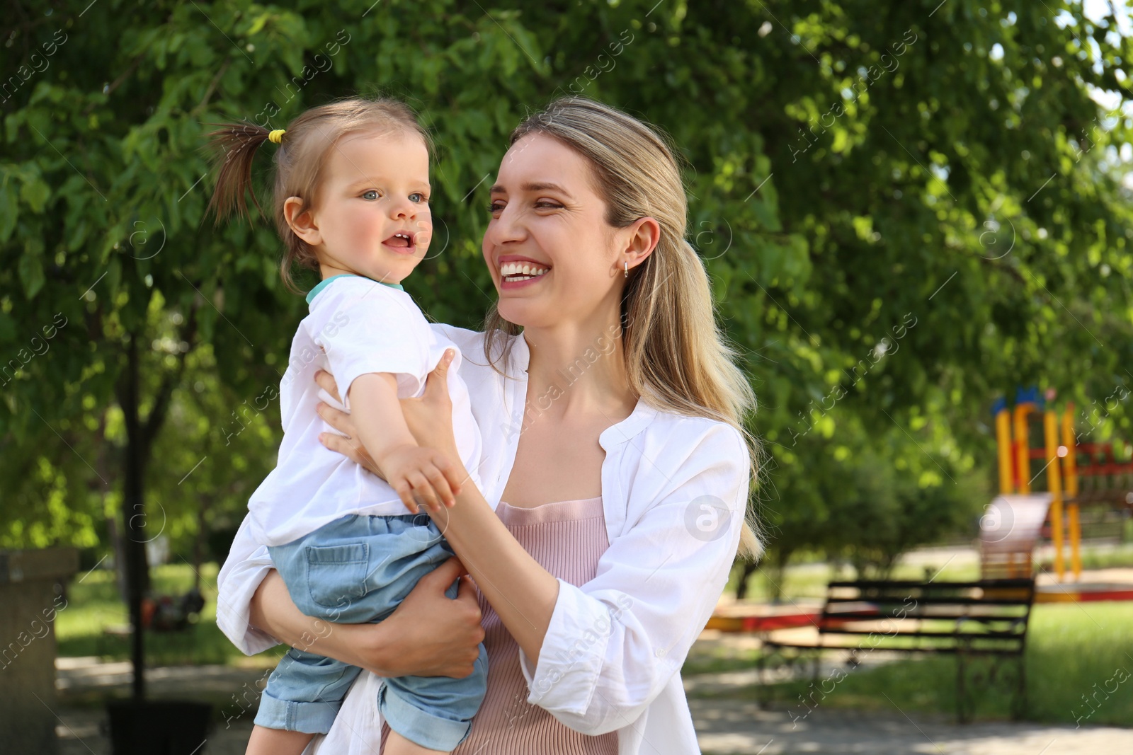 Photo of Happy mother with her daughter spending time together in park