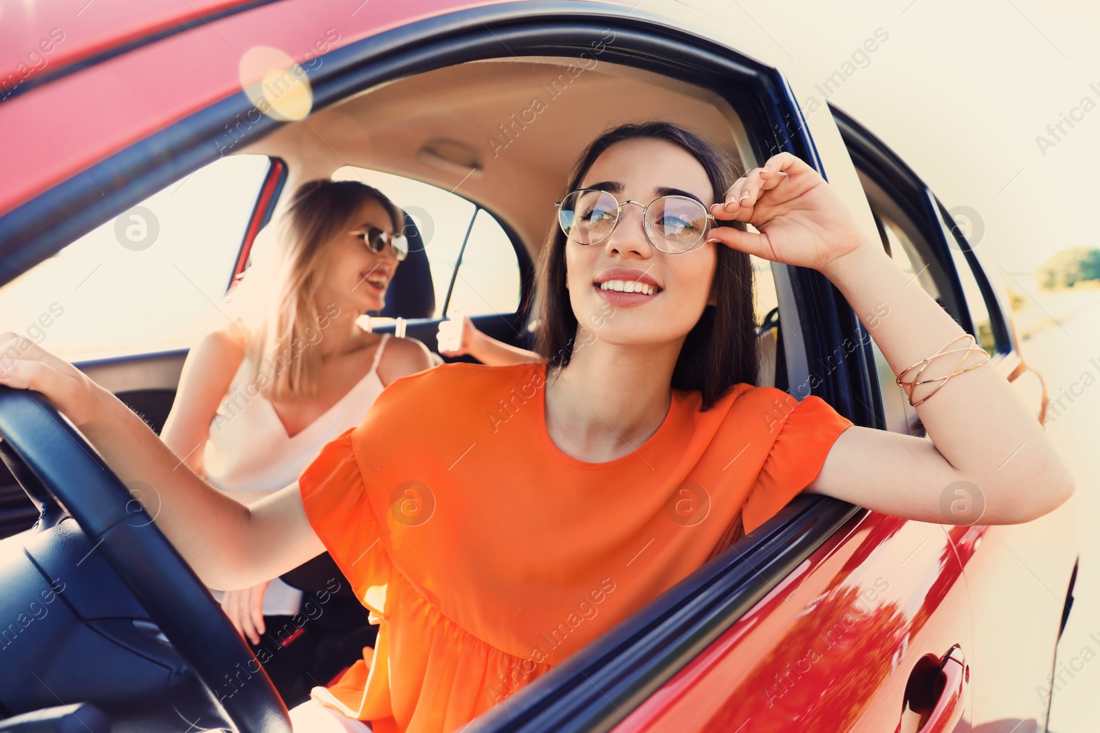 Photo of Happy beautiful young women together in car