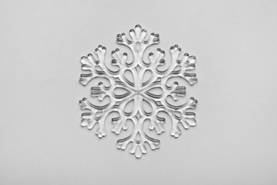 Beautiful decorative snowflake on light grey background, top view