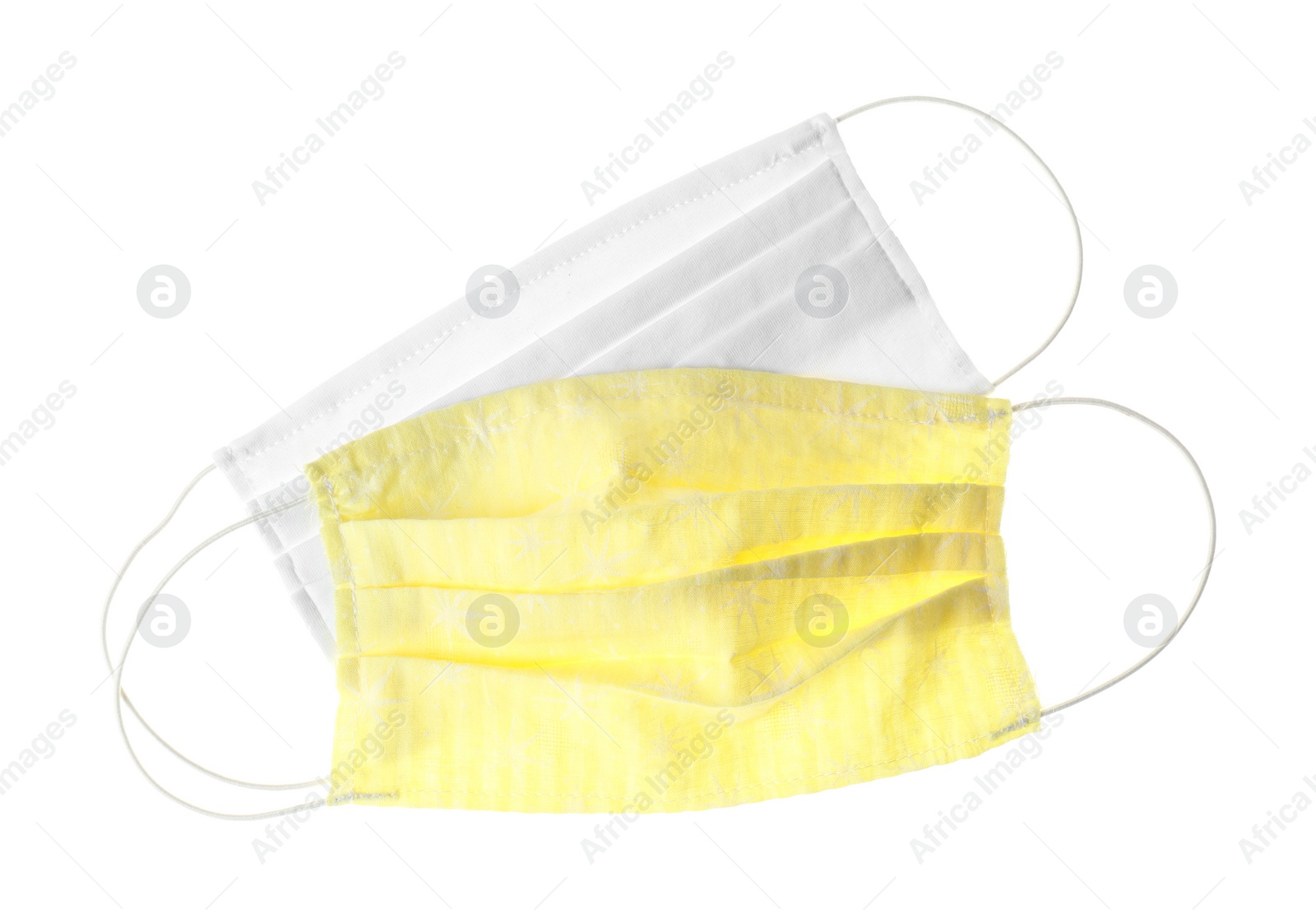 Photo of Homemade protective face masks isolated on white, top view