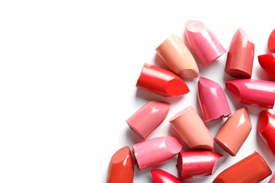 Photo of Collection of lipsticks on white background, top view