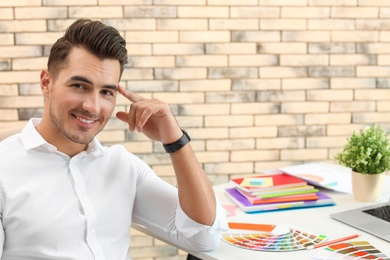 Photo of Portrait of handsome young man in office