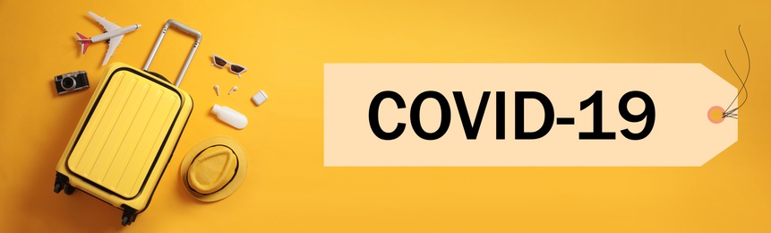 Image of Coronavirus pandemic, lockdown measures. Flat lay composition with travel suitcase and text COVID-19 on orange background, banner design