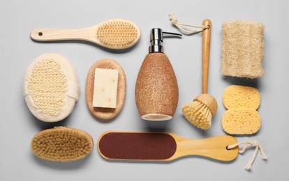 Photo of Bath accessories. Flat lay composition with personal care tools on light grey background