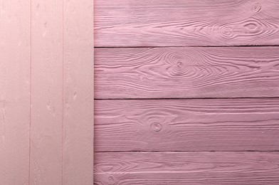 Photo of Pink wooden surfaces as background, top view
