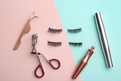 Photo of Flat lay composition with magnetic eyelashes and accessories on color background