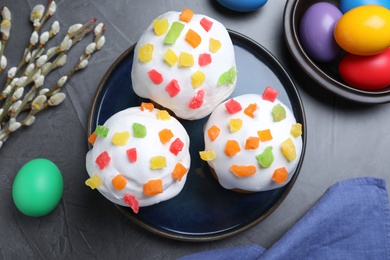 Photo of Flat lay composition with Easter cakes on dark grey table