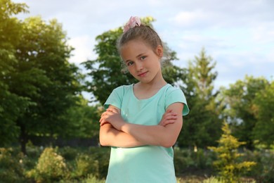 Photo of Portrait of cute little girl in park on sunny day