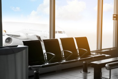 Photo of Row of seats in waiting area at airport terminal