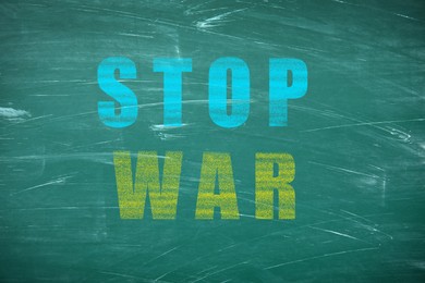 Image of Words Stop War in colors of Ukrainian flag on green chalkboard