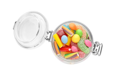 Photo of Many different candies in glass jar isolated on white, top view