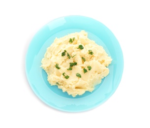 Plate with tasty mashed potatoes on white background, top view