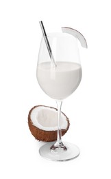 Photo of Glass of delicious coconut milk and coconut isolated on white