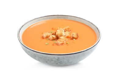 Photo of Tasty creamy pumpkin soup with croutons in bowl on white background