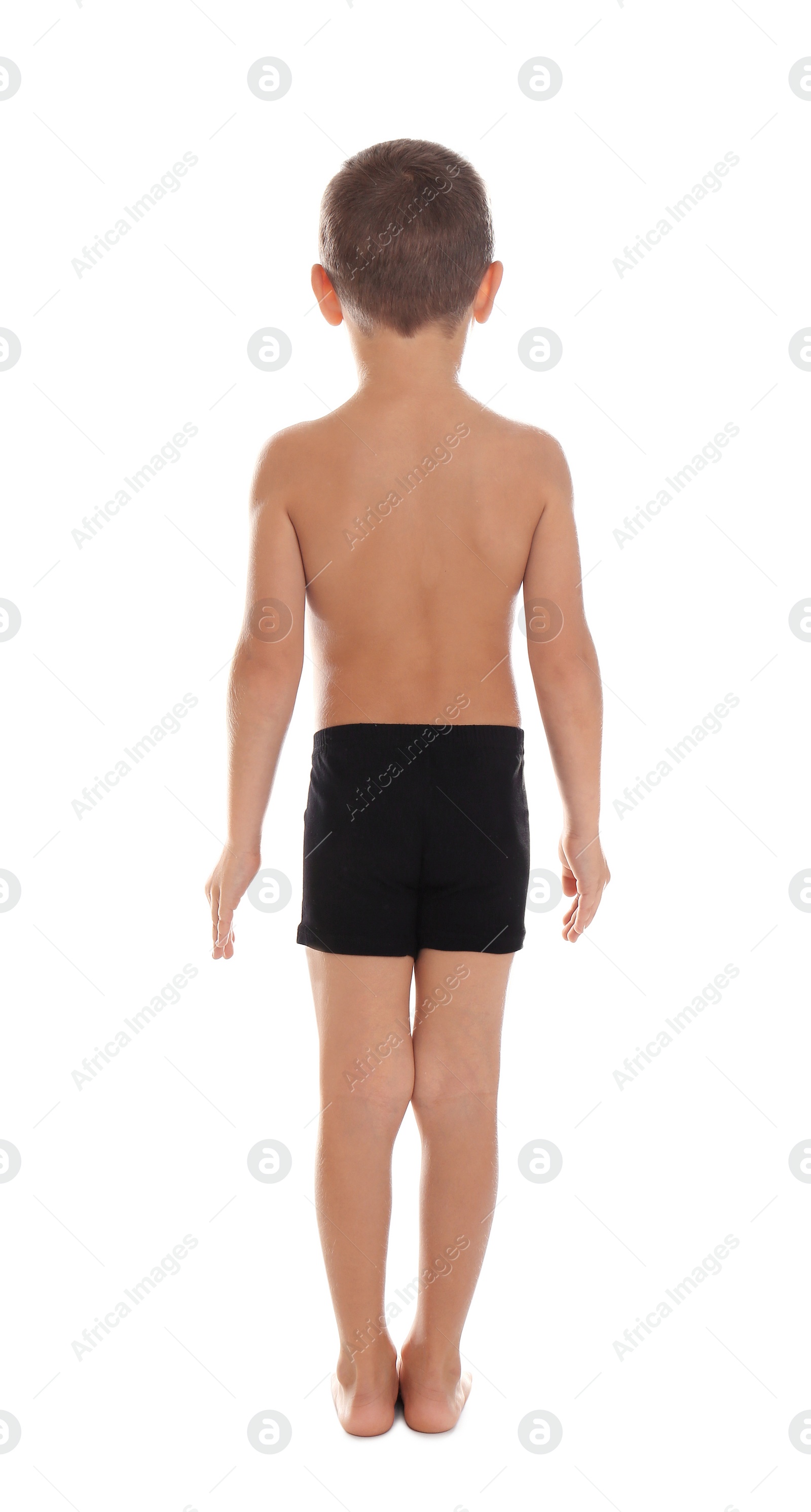 Photo of Little boy in underwear on white background, back view