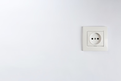 Photo of Power socket on white background. Electrician's equipment