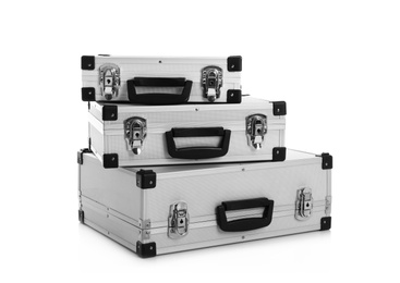 Photo of Set of modern suitcases on white background