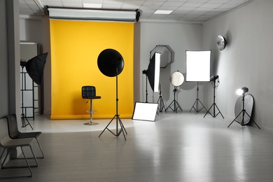 Photo of Interior of modern photo studio with professional equipment