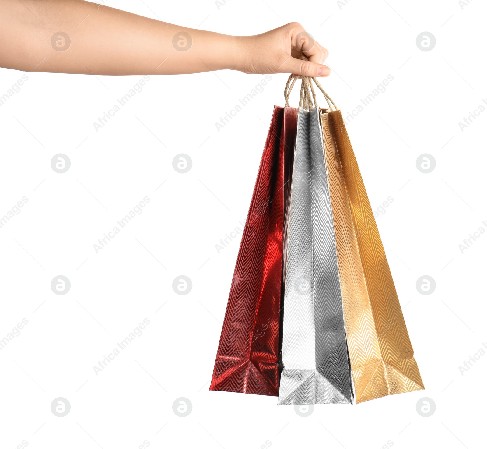 Photo of Woman holding paper shopping bags on white background, closeup