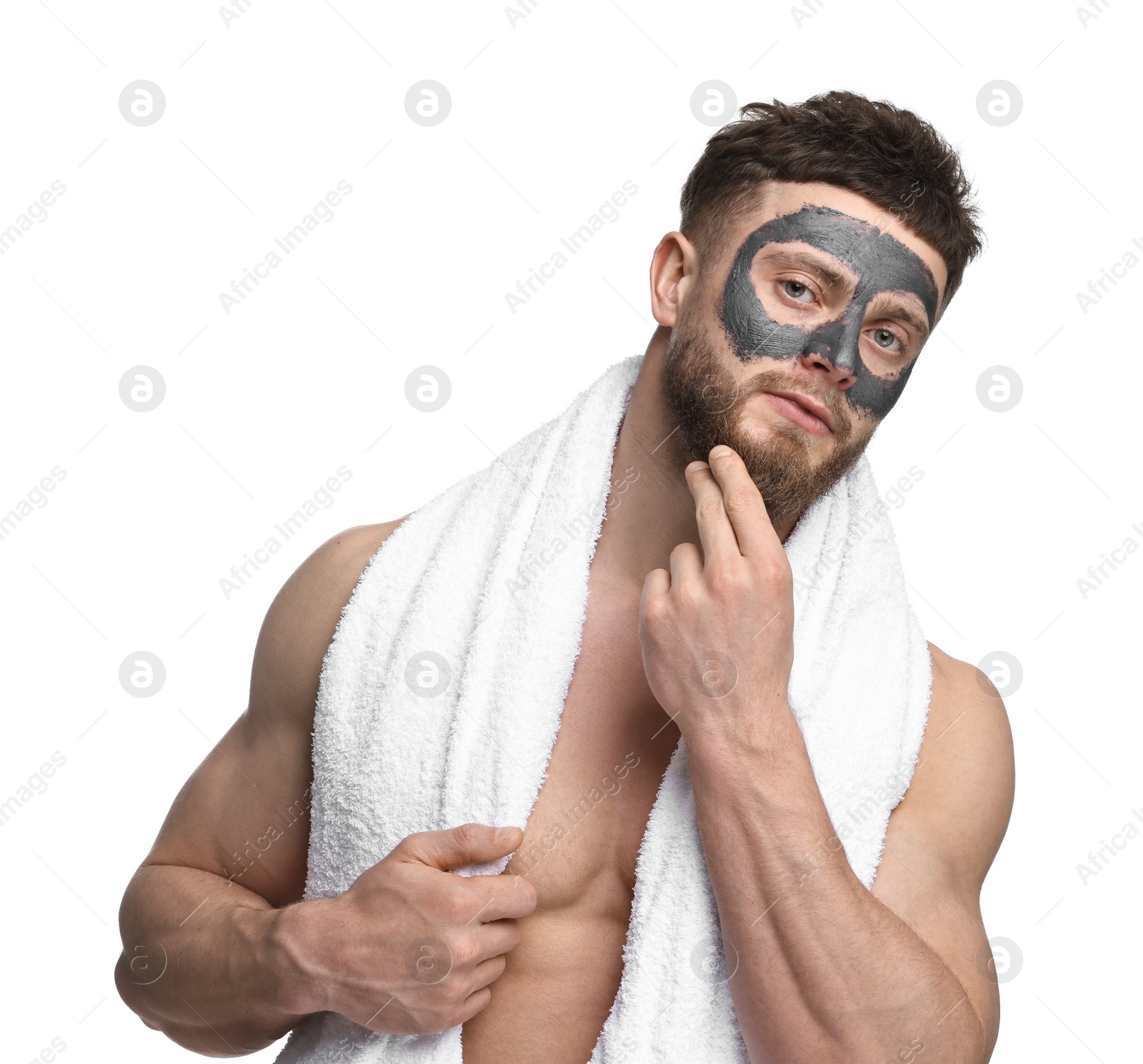 Photo of Handsome man with clay mask on his face against white background