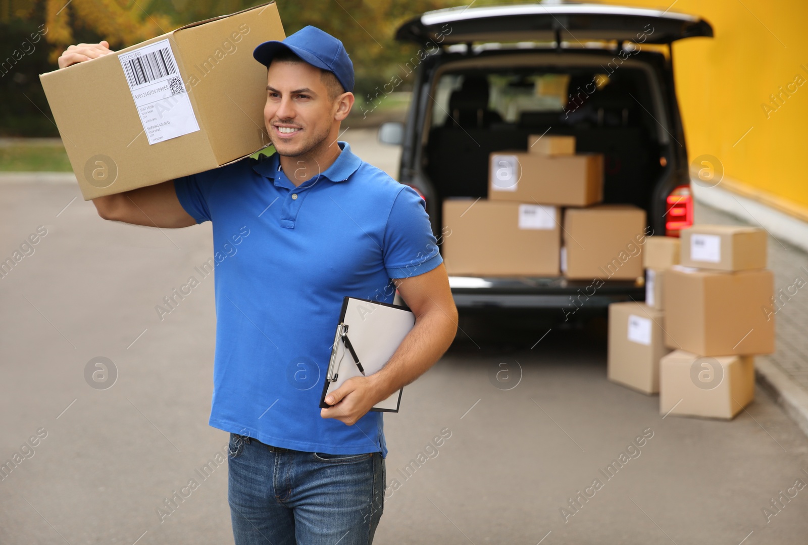 Photo of Courier with clipboard and parcel near delivery van outdoors. Space for text