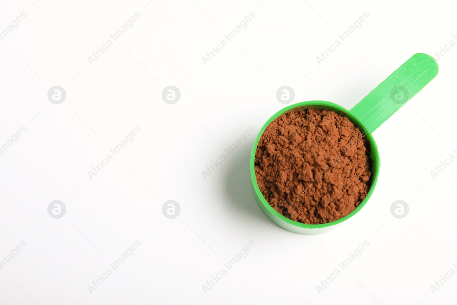 Photo of Scoop of protein powder on white background, top view