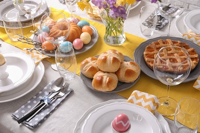 Photo of Festive Easter table setting with traditional meal