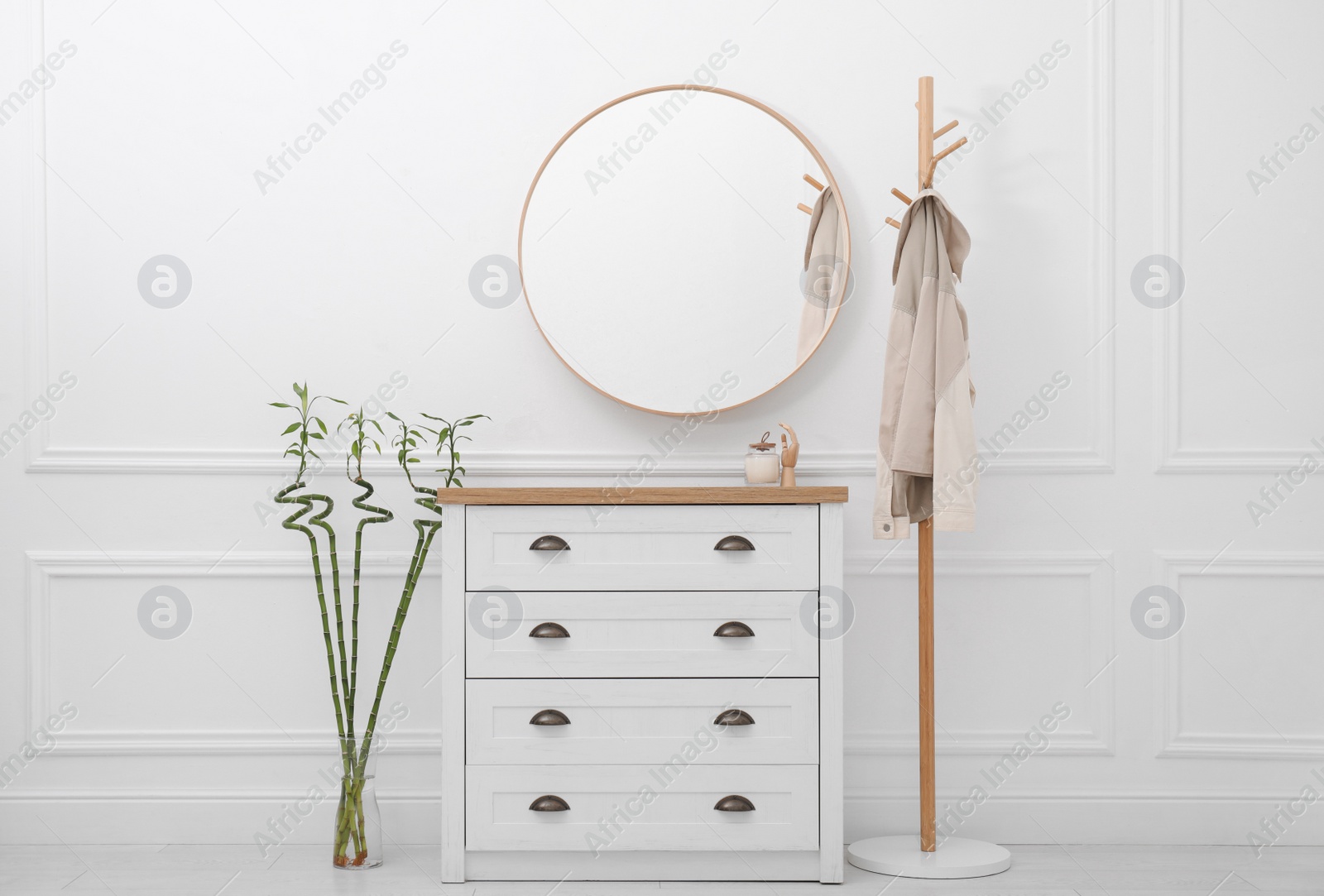 Photo of Hallway interior with Lucky bamboo and wooden furniture