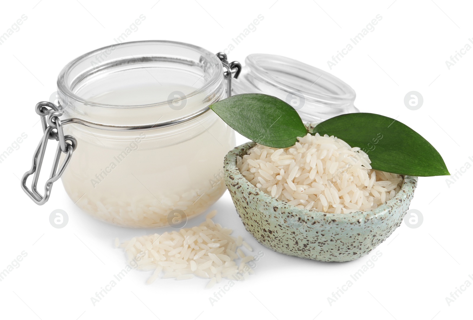 Photo of Homemade natural rice water and grains on white background