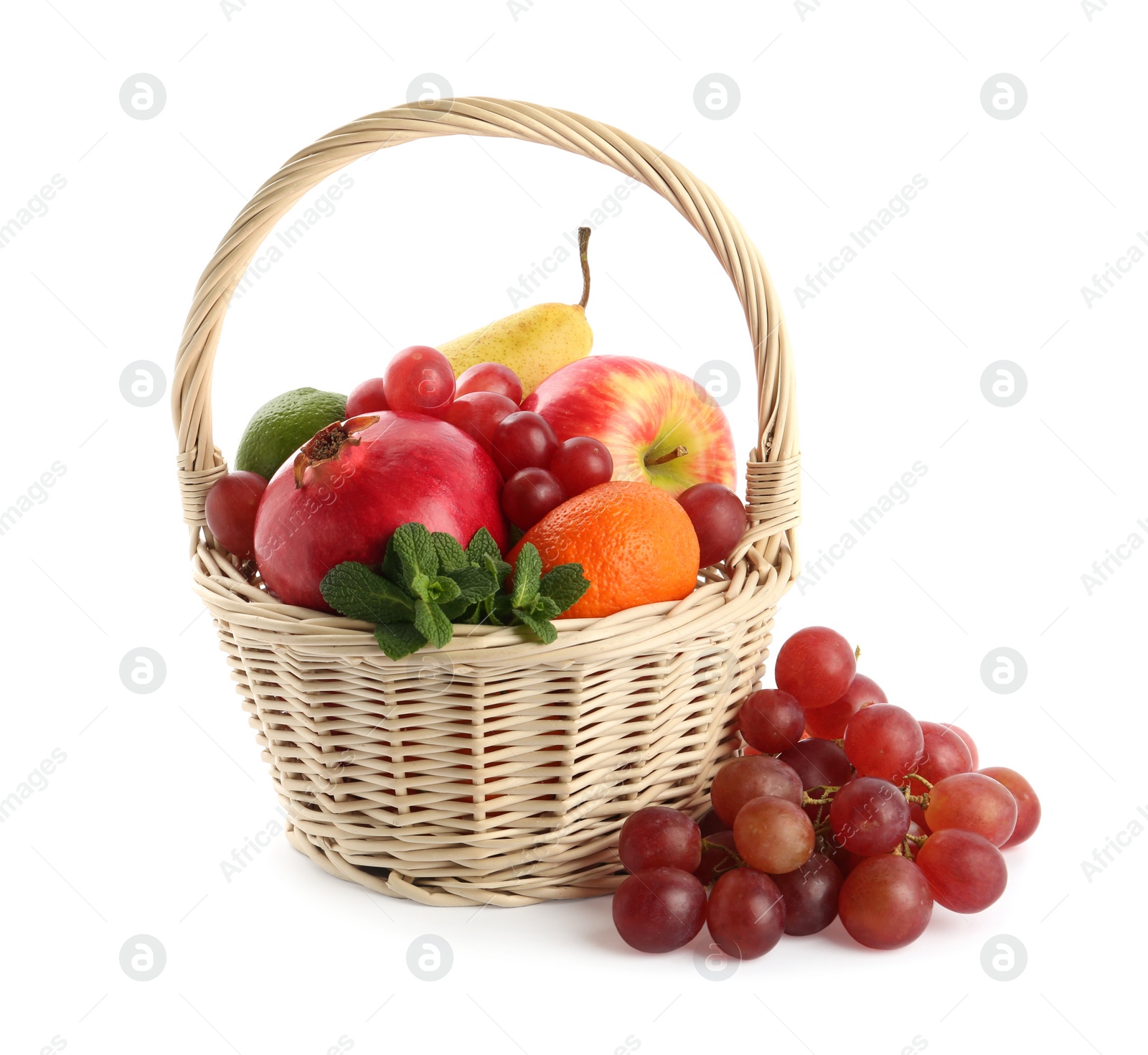 Photo of Wicker basket with different ripe fruits on white background