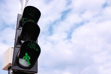 Photo of View of traffic light against blue sky. Space for text