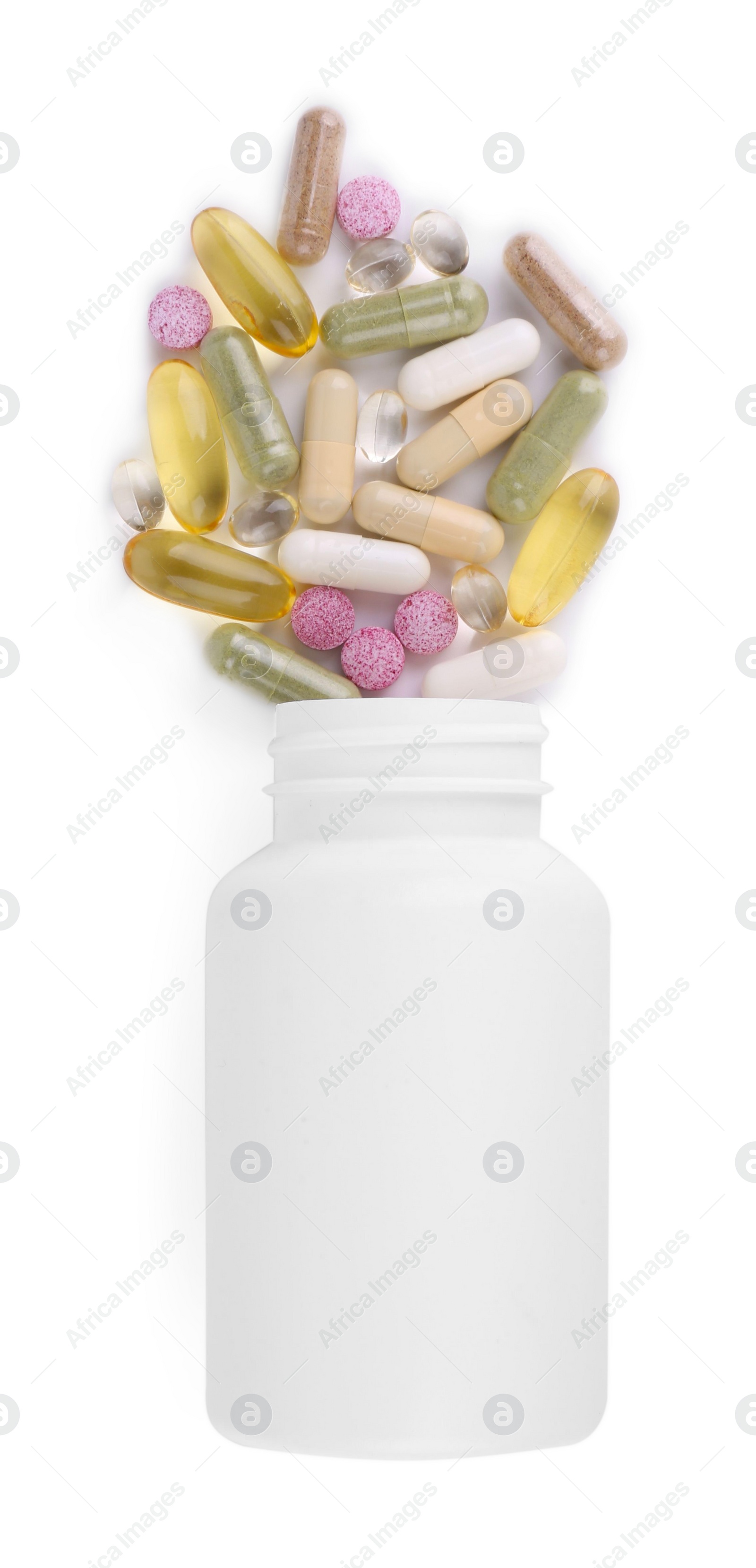 Photo of Bottle and different vitamin pills isolated on white, top view