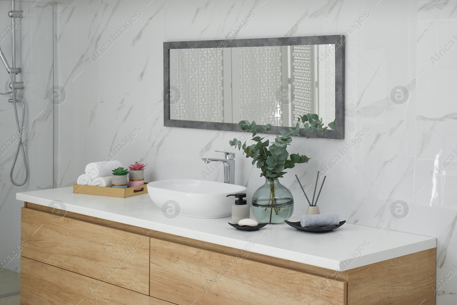 Photo of Modern bathroom interior with stylish mirror and vessel sink