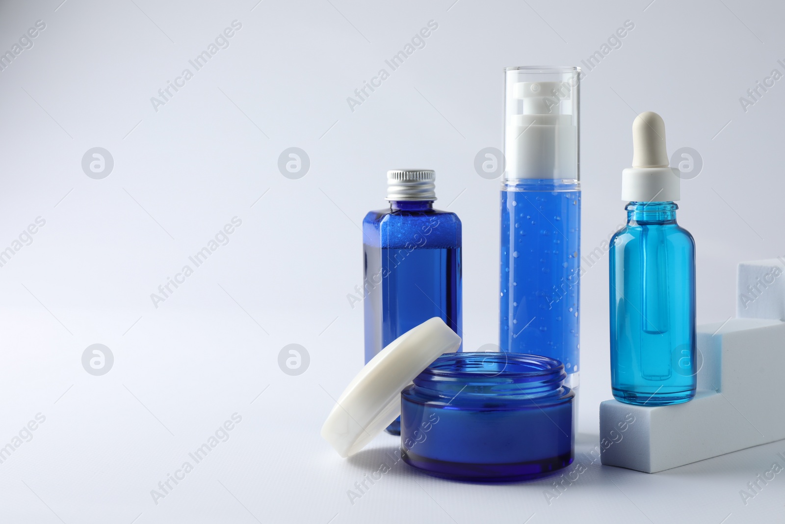 Photo of Set of luxury cosmetic products on white background. Space for text