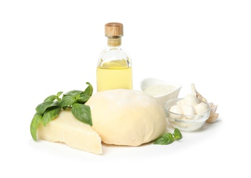 Photo of Composition with dough and fresh ingredients for pizza isolated on white