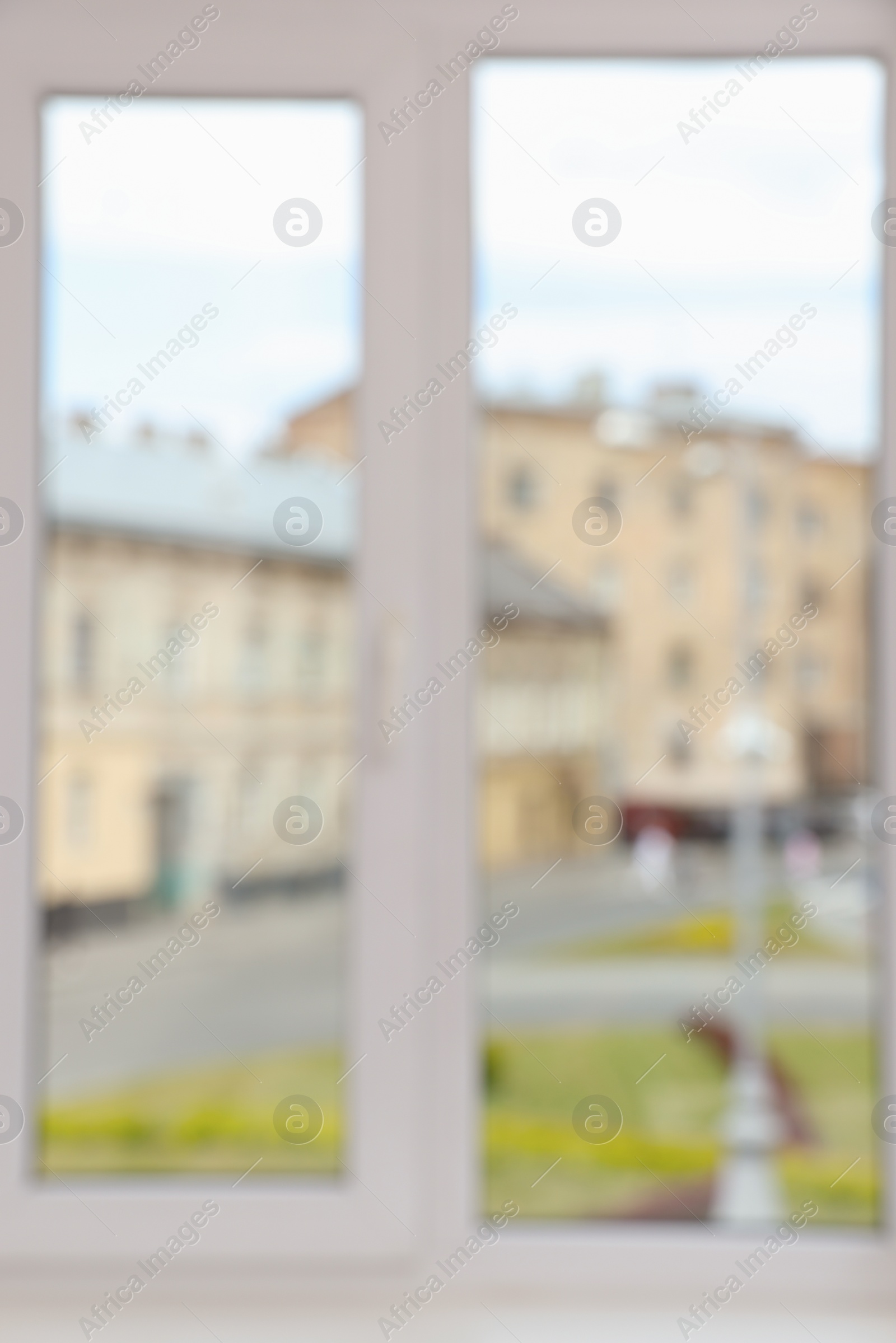 Photo of Blurred view of window with white frame indoors