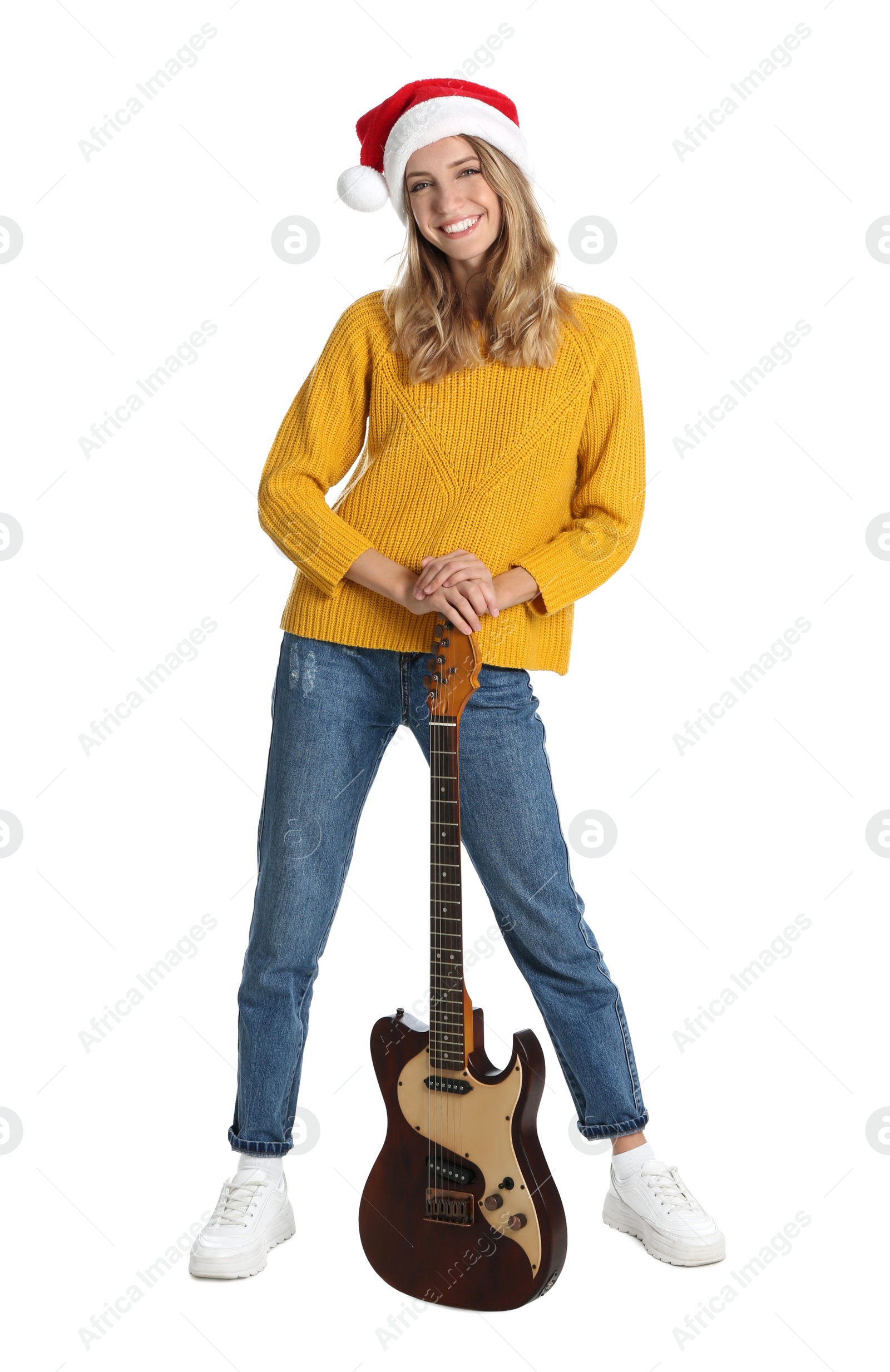 Photo of Young woman in Santa hat with electric guitar on white background. Christmas music