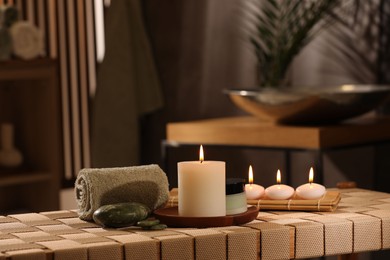 Photo of Beautiful composition with different spa products on wicker bench indoors