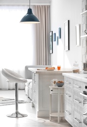 Photo of Modern kitchen interior in light apartment