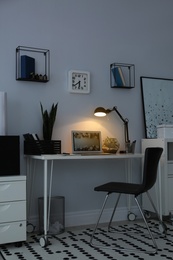 Comfortable workplace with modern laptop on desk. Home office