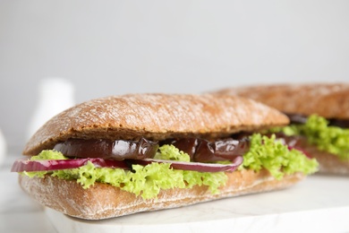 Photo of Delicious fresh eggplant sandwiches served on white table, closeup