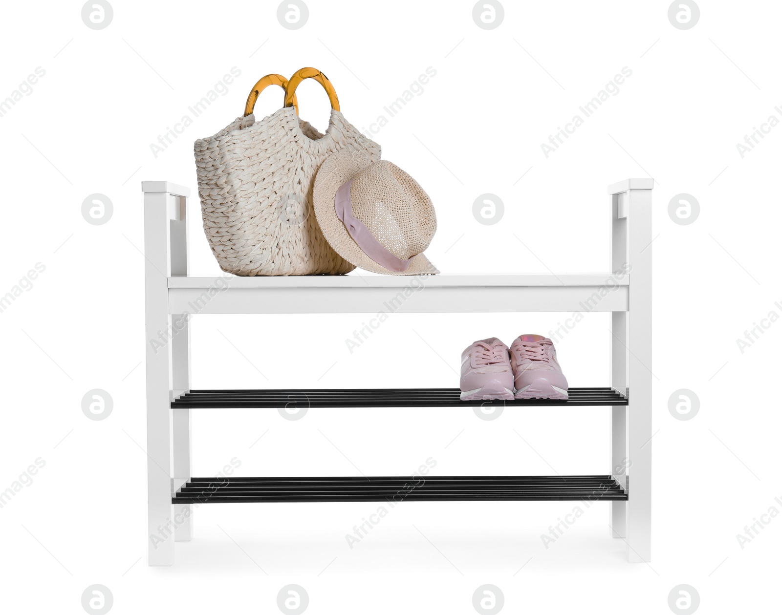 Photo of Stylish shoe shelf with sneakers, handbag and hat isolated on white